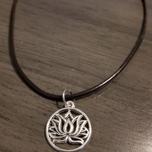 Lotus flower pendant on a leather necklace